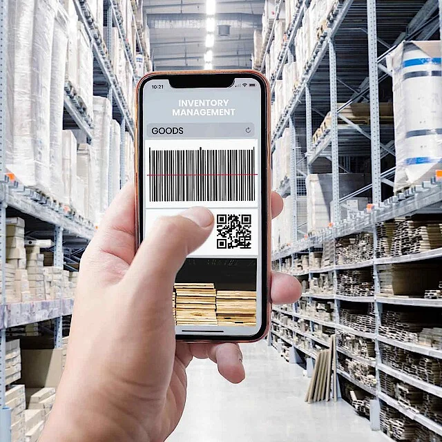 Mobile phone scans codes in a warehouse